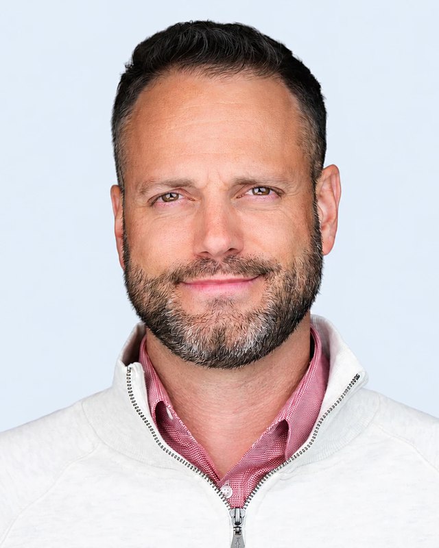 Dr. Sam Madeira, NMD, smiling warmly